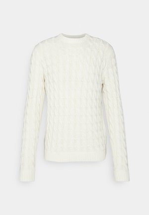 Kabelstrikka genser i off-white. Har rund hals, lange ermer, teksturert mønster og ribbestrikket hem og mansjetter.