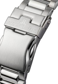 Bracelet de montre en acier inoxydable argenté avec une finition brossée, doté d'un fermoir rectangulaire à rabat gravé "JACQUES LEMANS."