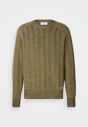 Zeleno-rumena sv sweaters z vzorcem ribje kosti, z rebrastim ovratnikom in manšetami ter z teksturiranim tkanim vzorcem po celotni površini.