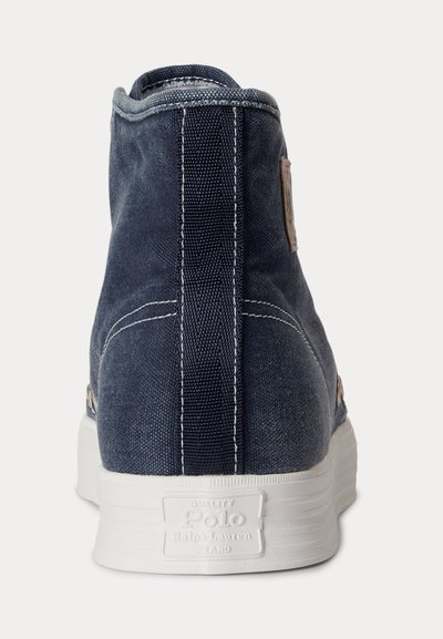 Rear view of a high-top navy blue canvas sneaker with white stitching and a white sole labeled Polo Ralph Lauren.