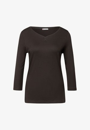 Mörkbrun, figurnära långärmad skjorta med V-hals, två knappslå och mjukt, lent tyg. Enkelt design utan mönster eller dekorationer.