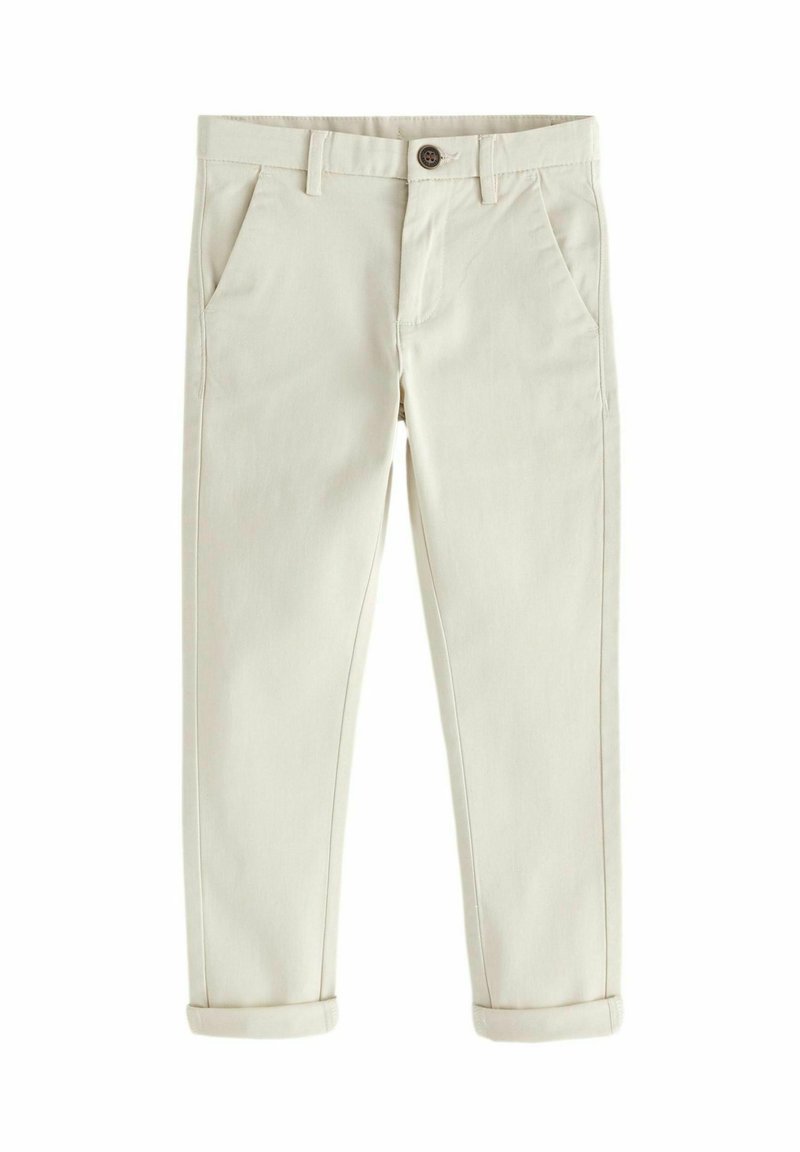 Pantalones de algodón beige claro con corte ajustado, frente plano, costuras sutiles, dos bolsillos laterales y puños enrollados en el dobladillo.