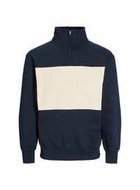Suéter en azul marino y crema con un alto cuello, que presenta un cierre de media cremallera y el texto grabado "ORIGINALS" en el pecho. Fabricado con tela suave.