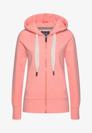 Kapuzensweatshirt mit Reißverschluss aus weichem Korallstoff. Mit einem durchgehenden Reißverschluss vorne, weißen Kordeln und zwei Seitentaschen. Rippbündchen an den Ärmeln und am Saum.