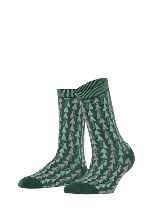 Pair of green socks with light green and gray tree patterns and ribbed cuffs displayed on white background.