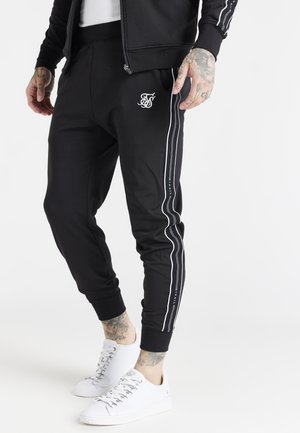 STATUS TAPE CUFFED PANTS - Pantaloni sportivi - black