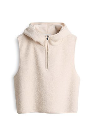 Crème-kleurige mouwloze top van zachte, gestructureerde fleece met een capuchon en een front-rits. Heeft een cropped ontwerp en onafgewerkte randen.