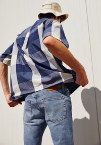 Levi's® 512™ SLIM TAPER - Calças de ganga justas - medium indigo worn in