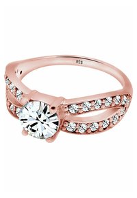 Roségoldring mit einem zentralen runden klaren Stein, flankiert von kleineren Steinen in einem geteilten Banddesign. Innen mit 925 punziert.
