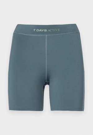 Light blue active shorts with a smooth texture, mid-thigh length, and a logo at the waistband; features reinforced stitching.