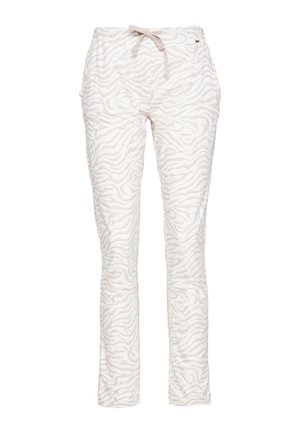 Women’s slim jogger pants with light beige and white zebra print and a front drawstring waist.