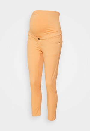 Calças de maternidade em cor laranja clara, com cintura elástica, pernas ajustadas e design clássico de cinco bolsos. Material em mistura de algodão.