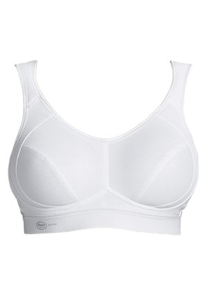 Witte sportbeha met verstelbare banden, een brede band en naadloze cups, gemaakt van ademende stof met versterkte naden.
