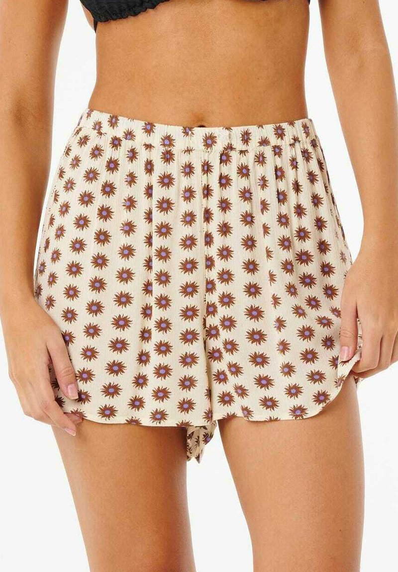Bedruckte Shorts mit einem elastischen Bund, die einen cremefarbenen Hintergrund und ein braunes Sonnenstrahlenmuster mit lila Akzenten aufweisen. Glattes Material, lockere Passform.