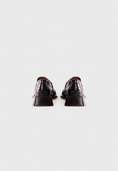Pair of glossy dark burgundy leather dress shoes with low block heels, viewed from the back on a plain white background.