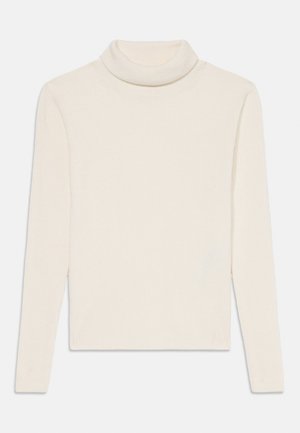 Kremasta turtleneck pulover iz rebraste tkanine, z dolgimi rokavi in prilegajočim se krojem ter visokim ovratnikom.