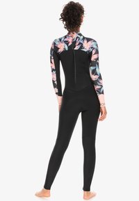 Black wetsuit with floral long sleeves, featuring a zipper on the back and a form-fitting design, ideal for water activities.