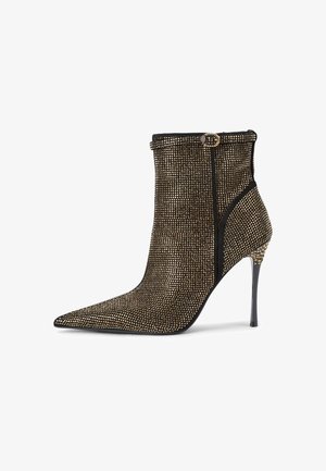 Enkellaarsjes met een spitse neus, zwart en metallic gouden gaasontwerp, met een stijlvolle glans, een zijrits en een hoge stilettohak.