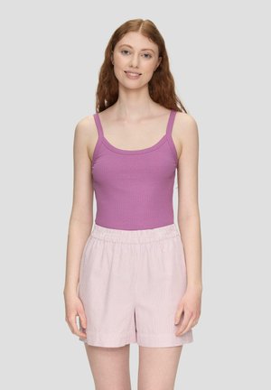 Purple ribbed tank top with thin straps paired with light pink striped shorts. The shorts have an elastic waistband and a loose fit.
