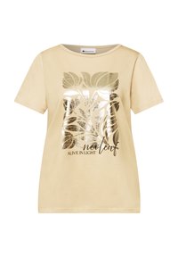 T-shirt beige à manches courtes avec un graphique feuille dorée brillante et le texte « ALIVE IN LIGHT neoleaf » à l'avant.