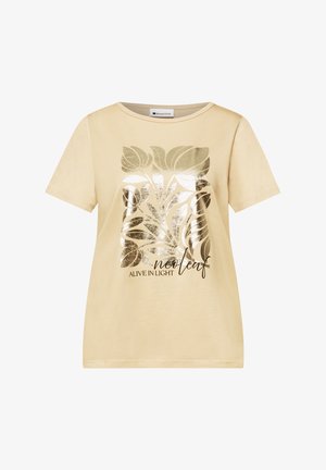 T-shirt beige a manica corta con grafica di foglia dorata lucida e scritta "ALIVE IN LIGHT neoleaf" sul davanti.