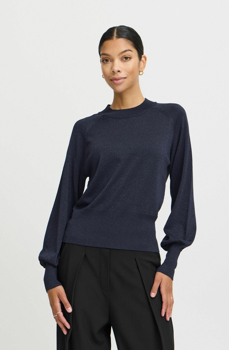 Navyblauer Pullover mit taillierter Passform, lockeren Ärmeln und einer subtilen Glitzertextur. Gerundeter Halsausschnitt, glattes Material und gerippte Bündchen.