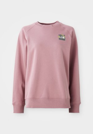 Lys rosa hettegenser med lange ermer, ribbestrikkede mansjetter og utringning. Har et blomsterdesign-patch på øvre venstre bryst. Myk tekstur.