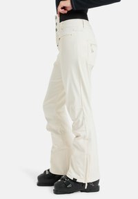 Crème-kleurige sneeuwbroeken met een hoge taille, knoop- en ritsluitingen, zijzakken en een ontspannen pasvorm. Gestructureerde stof met versterkte boorden.