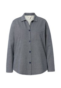 Camisa de botones en tela de espiga gris oscuro, con un cuello con solapa, mangas largas y un bolsillo en el pecho. Presenta botones en color marino.