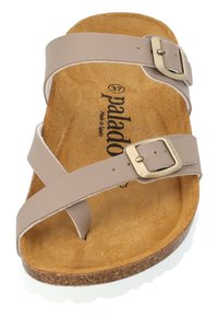 Brown platform sandal featuring two wide faux leather straps with brass buckles, a soft suede footbed, and a textured cork sole.