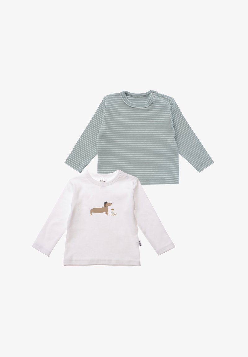 Two long-sleeve shirts: one light green with horizontal stripes, one white with a brown dog graphic and "woof" text. Soft cotton material.