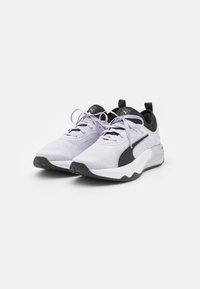 Sports shoes featuring a textured white and grey mesh upper, black accents, grey sole, and contrasting laces for a secure fit.