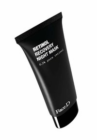 Packaging tubolare nero con finitura opaca. L'etichetta presenta un testo bianco che indica "Maschera Notturna al Retinolo" e "0,3% di retinolo puro."