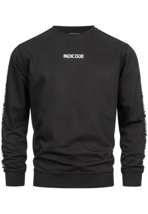 Sweat-shirt noir en coton, avec un col rond, des manches longues, et le mot "INDICODE" imprimé en blanc sur la poitrine et les manches.