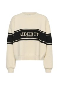 Sweatshirt crème avec une rayure noire et le texte "LIBERTY UNIVERSITY". Tissu doux, col rond, coupe ample, poignets et ourlet côtelés.