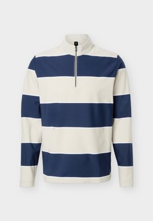Pull-over à manches longues avec rayures horizontales bleu marine et blanches, doté d'un col zippé à moitié et d'une coupe décontractée.