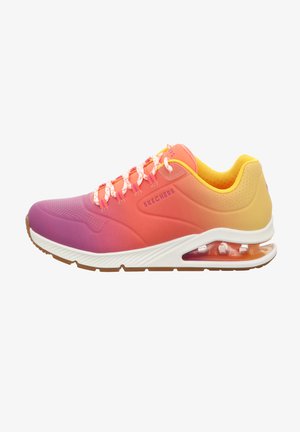 Skechers athletic shoe featuring an ombre design in pink, orange, and yellow hues. Textured mesh upper, rubber sole, and visible air cushioning.