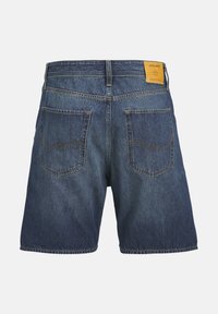 Denim shorts with a medium blue wash, featuring two back pockets, visible stitching, and a leather logo patch at the waist.