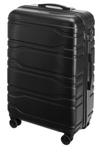 Valise rigide noire avec une surface texturée, conçue avec des rainures horizontales, une poignée rétractable et quatre roues multidirectionnelles.