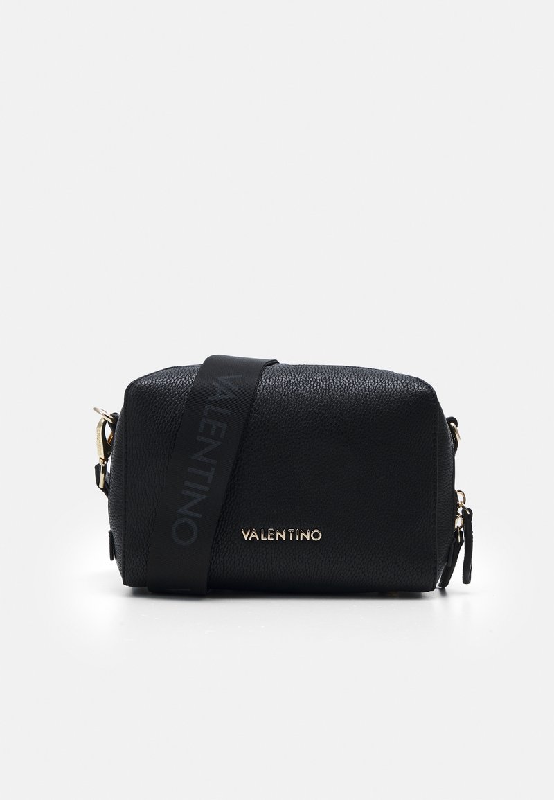 Black leather crossbody bag with a textured surface, gold hardware, and a logo-accented strap. Compact rectangular shape with zipper closure.