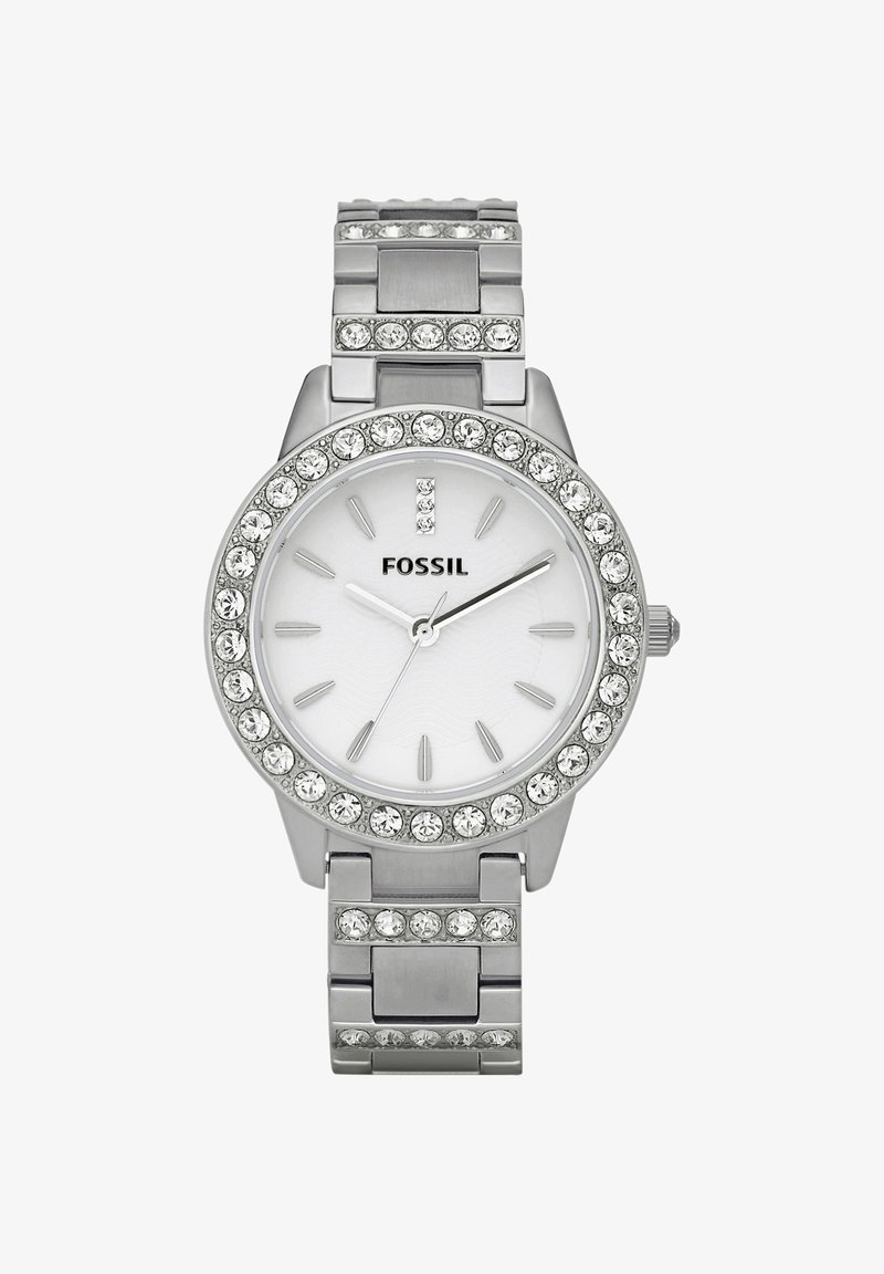 Montre-bracelet Fossil argentée avec une lunette et un bracelet ornés de cristaux, cadran blanc, index argentés et trois aiguilles indiquant 10:10:36.