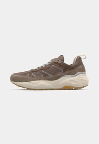 Brown suede sneaker with mesh accents, grey detailing, and white midsole. Features a textured rubber outsole and a small yellow logo.