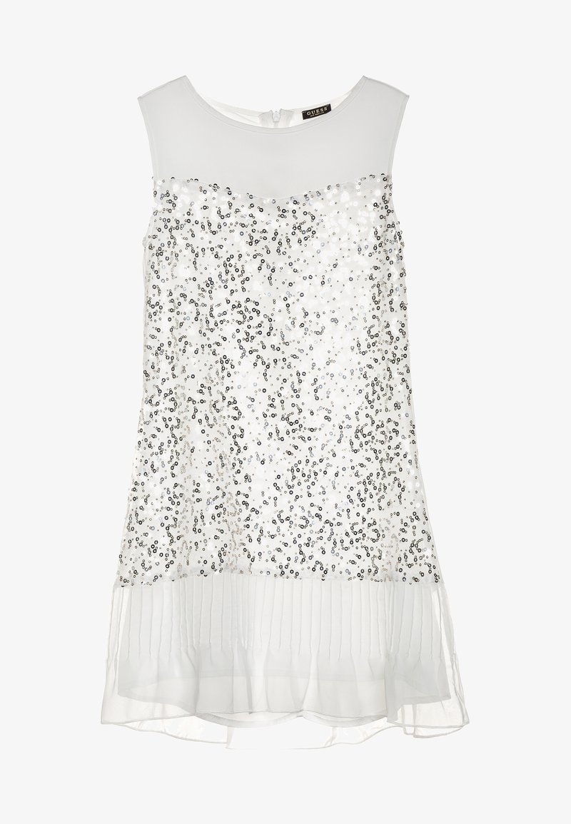 Robe blanche sans manches avec un ornement de sequins sur le corsage, ourlet plissé transparent et décolleté rond. Fermeture éclair au dos.