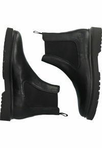 Botas chelsea de cuero negro que cuentan con paneles laterales elásticos, suela de goma texturizada y tiradores en el talón para facilitar su uso.