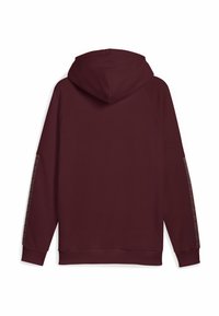 Felpa bordeaux con cappuccio regolabile, maniche raglan e strisce decorative lungo le maniche esterne. Realizzata in tessuto morbido.