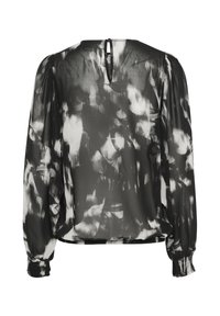 Black and white printed blouse with long balloon sleeves, back keyhole detail, and elastic cuffs, made from a lightweight, semi-sheer fabric.