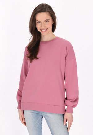 Lyserød sweatshirt med lange, voluminøse ærmer og rund halsudskæring. Stoffet ser blødt ud, og den har en afslappet pasform med struktureret kant.