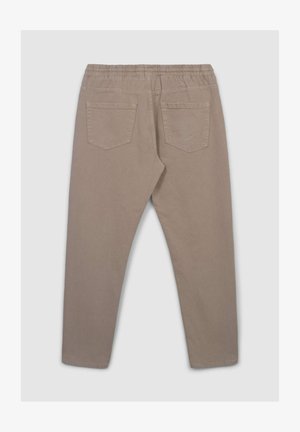 Jasno beżowe spodnie z elastycznym paskiem, dwoma tylnymi kieszeniami i zwężającym się krojem nogawki. Wykonane z miękkiego, strukturalnego materiału.