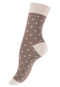 Calzino alla caviglia marrone con un risvolto beige chiaro, decorato con pois bianchi. Realizzato in materiale morbido con texture a costine nella parte superiore e con tallone rinforzato.