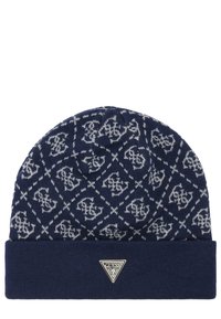 Gorro de punto azul marino con patrones geométricos blancos, con dobladillo, y una etiqueta triangular plateada en la parte frontal. Textura suave y diseño cálido.